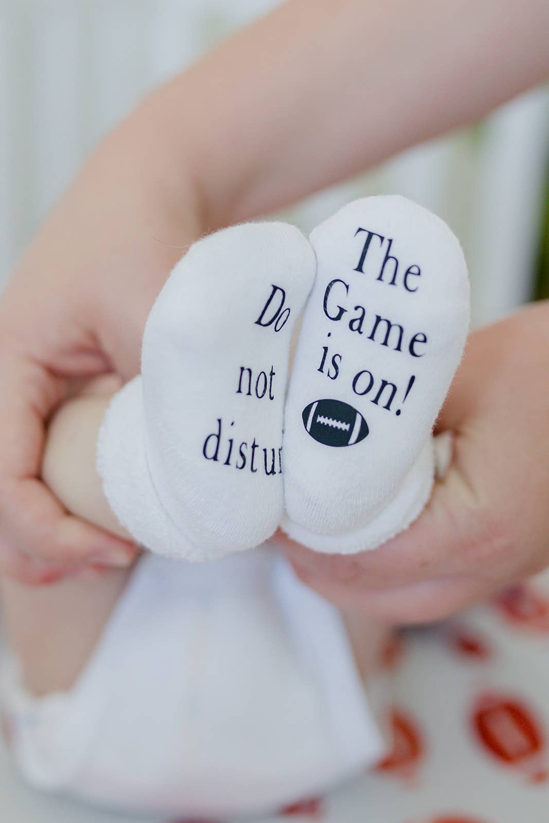 Do Not Disturb The Game is on Football Baby Socks