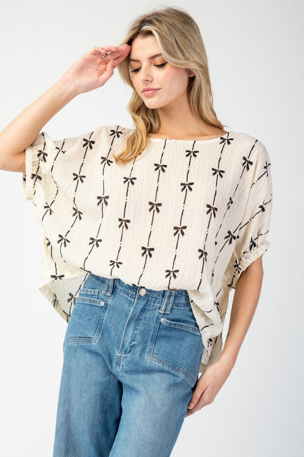 Cream Bow printed short sleeve top