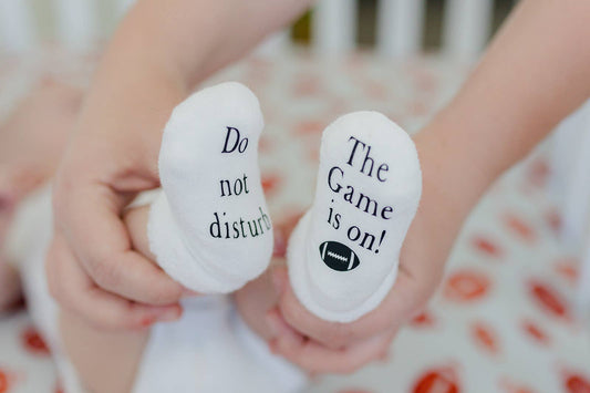 Do Not Disturb The Game is on Football Baby Socks